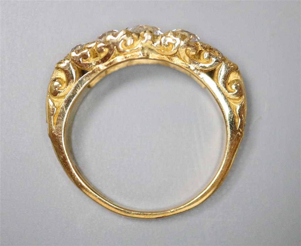 A modern Victorian style 18ct gold and graduated old round cut diamond set half hoop ring,